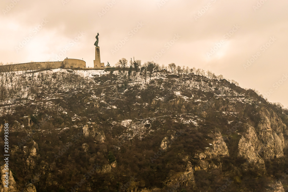 Budapest mountain gellert high city sight with fort pommel and statue of freedom view of the river Don river. Budapest Hungary February 2018