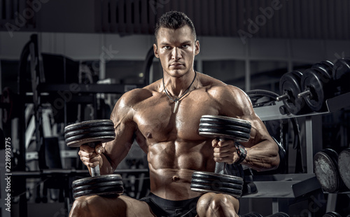 guy bodybuilder with dumbbell © tankist276