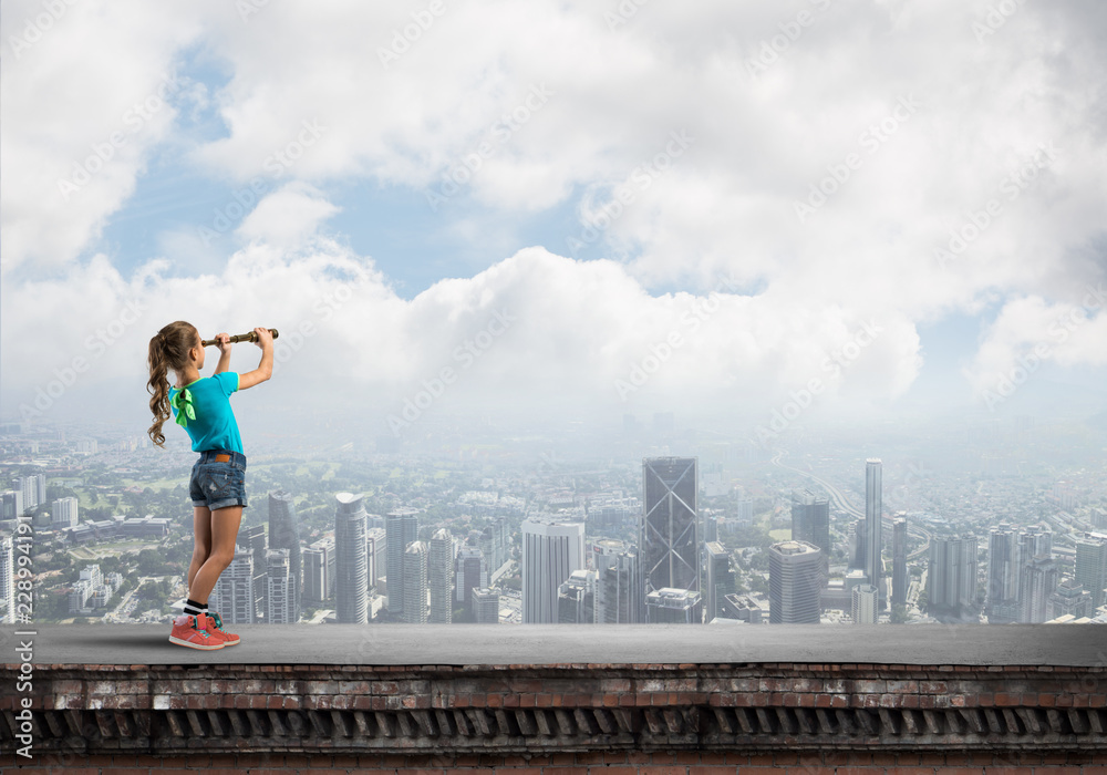 Concept of careless happy childhood with girl exploring this world Concept of careless happy childhood with girl exploring this world