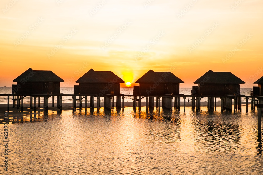 Luxury water lodges in sunset on Olhuveli island. Maldives. Luxury water lodges in sunset on Olhuveli island. Maldives.