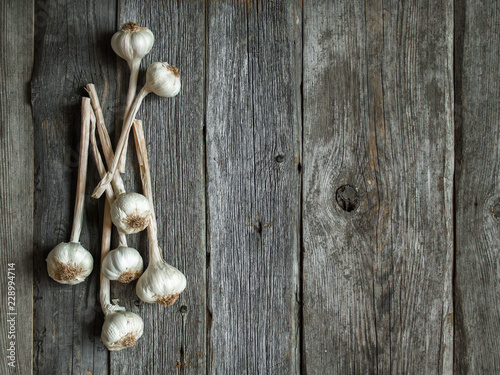 Bunch of garlic heads shot from above on wooden background