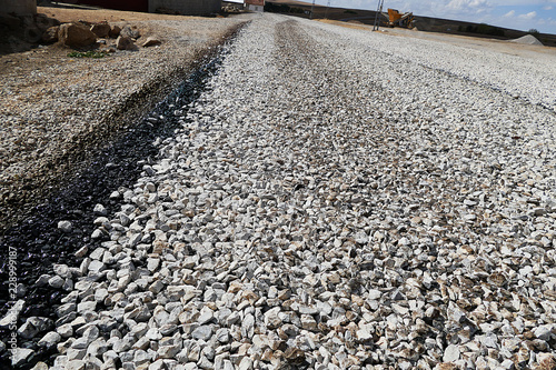 newly constructed asphalt road works, pitch and road