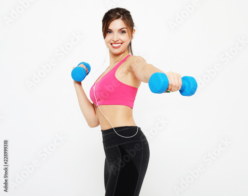sport and people concept: Young girl athlete, fitness with dumbbells