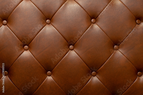 Brown genuine leather sofa background.
