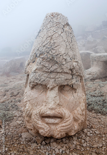 Ancient stone statue of Heracle on the top of Nemrut mount, Anatolia, Turkey photo