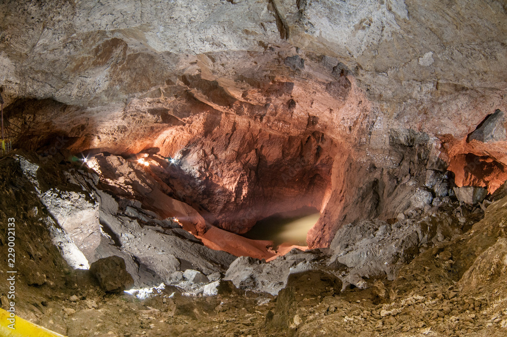 Blue lake in an underground cave. The concept of natural dark areas. Blue lake in an underground cave. The concept of natural dark areas.
