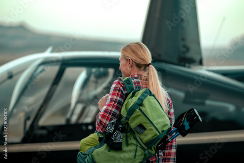 Canvas Print Woman Taking A Helicopter Hiking Tour In The Remote Deserts Of The Utah Canyonla