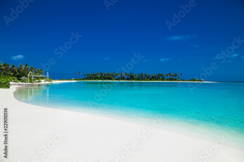Beautiful beach with white sand at tropical Olhuveli island  Maldives.