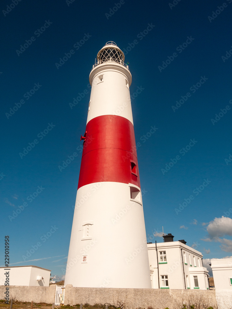 white and red large lighthouse isle of portland weymouth building summer