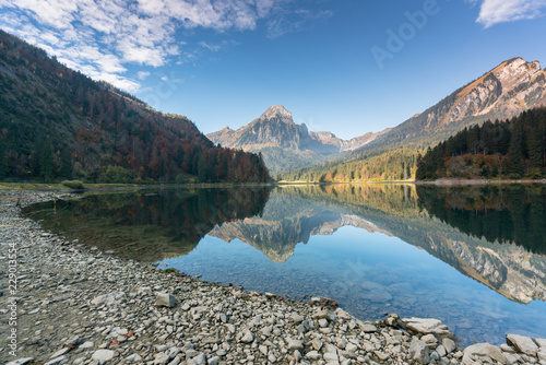autumn color mountain landscape and lake in the Swiss Alps photo