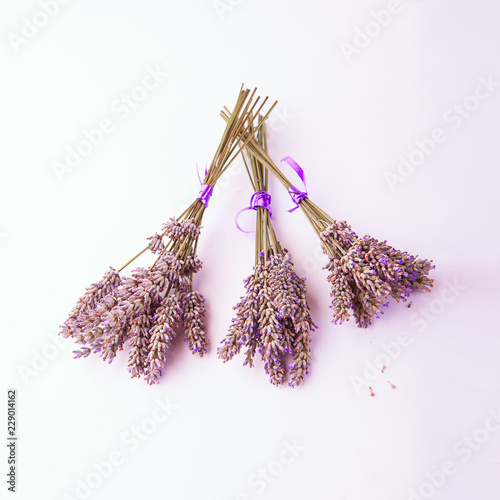 Fototapeta Naklejka Na Ścianę i Meble -  Three Lavender Bunches tied with purple ribbon