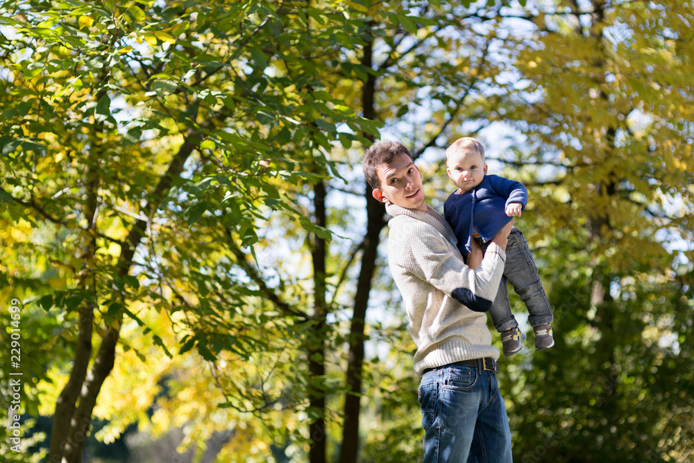 dad with baby in autumn park