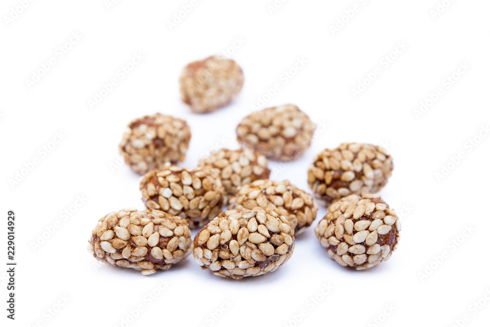 Coated peanuts with sesame isolated on white background Coated peanuts with sesame isolated on white background