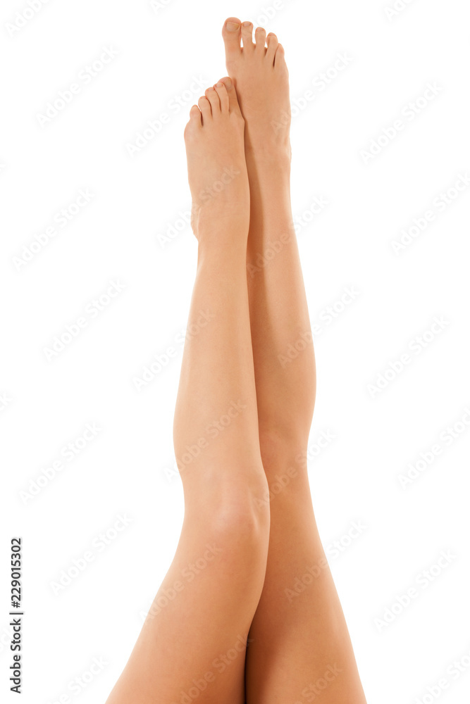 Beautiful long slim and elegant woman legs isolated over white background Beautiful long slim and elegant woman legs isolated over white background
