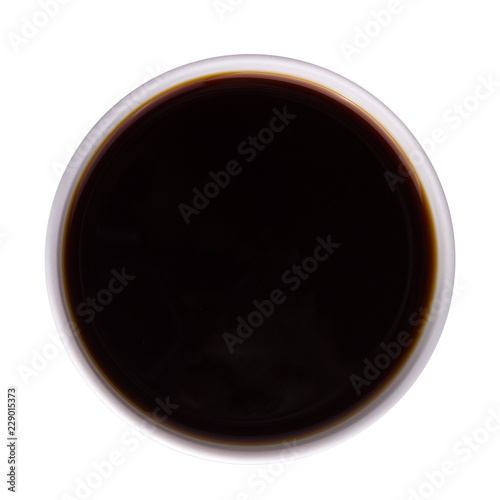 Top view of dish with tasty soy sauce isolated on white background.