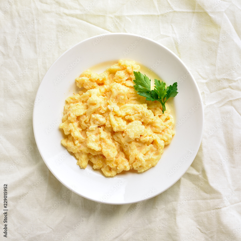 Plate with scrambled eggs Plate with scrambled eggs
