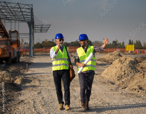 Enginers talking at building site