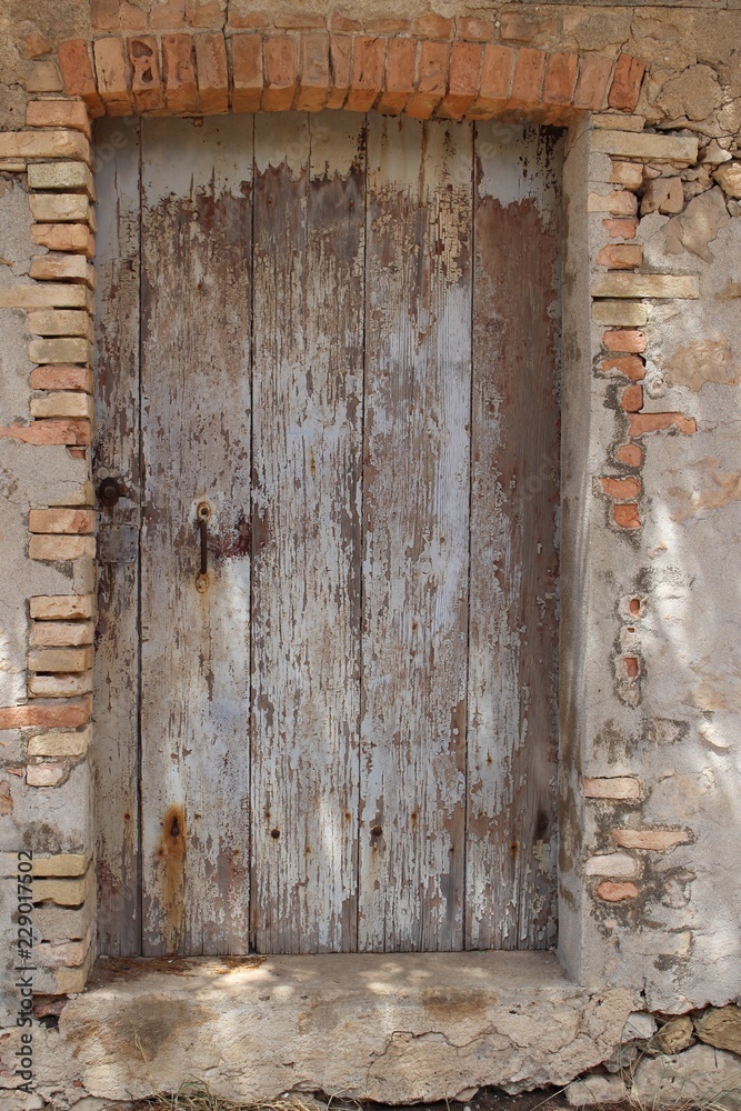 old wooden door in wall