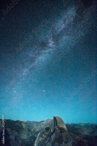Starry night sky with Milky Way above Half Dome peak, Yosemite National Park, USA © JFL Photography