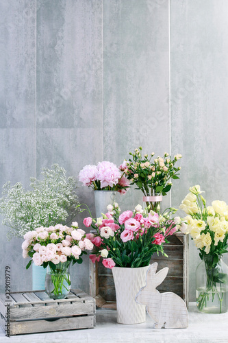 Beautiful flowers on grey, stone background