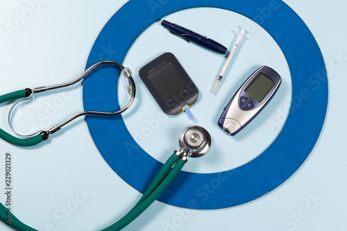 Blue circle with some Diabetes equipment do treatment the disease. photo