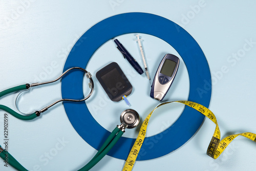 Blue circle with some Diabetes equipment do treatment the disease. photo