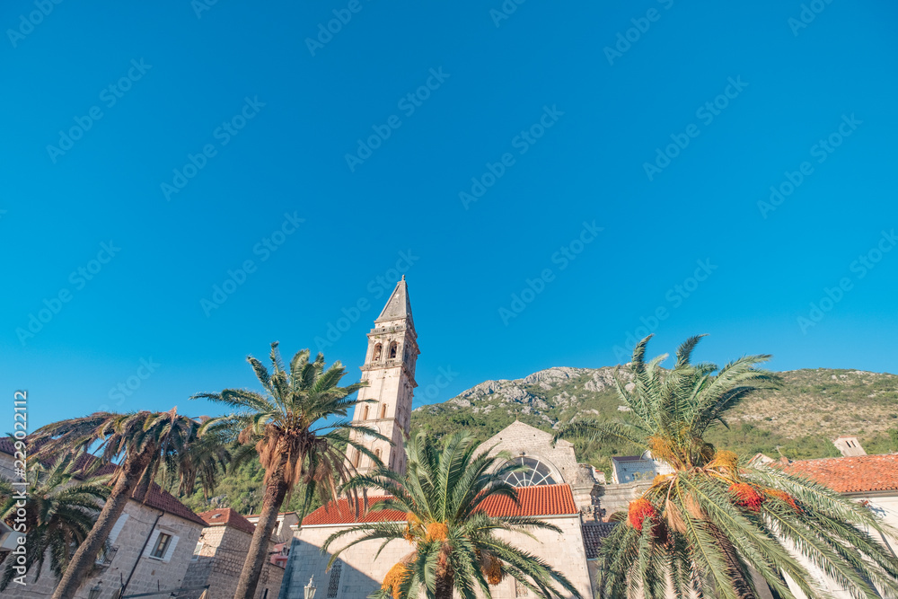 Perast, Montenegro showing the tower, the sea, and the mountains