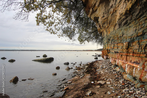 Autumnal limestone cliff seashore next to Baltic Sea in Estonia with copy space