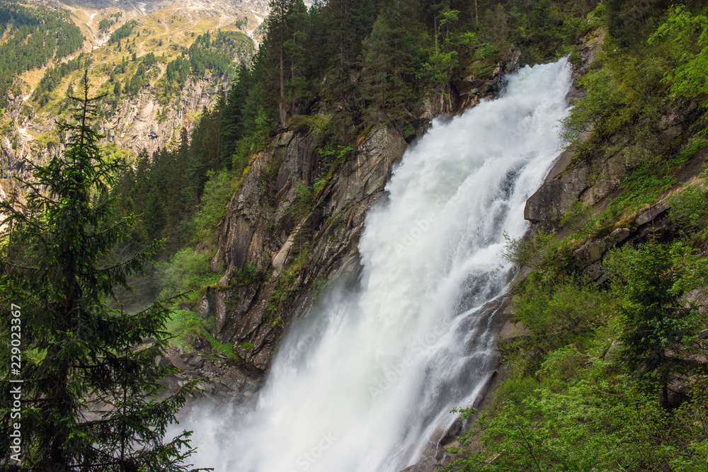 View Alpine inspiring Krimml waterfall in mountains in summer day. Trekking in National park Hohe Tauern, Austria View Alpine inspiring Krimml waterfall in mountains in summer day. Trekking in National park Hohe Tauern, Austria