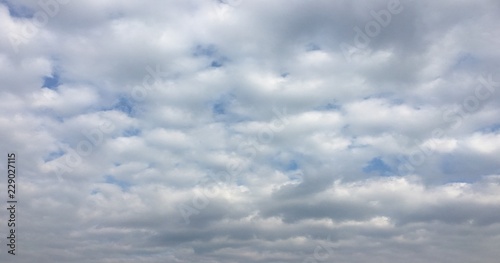 Beauty cloud against a blue sky background. Sky slouds. Blue sky with cloudy weather, nature cloud. White clouds, blue sky and sun. photo