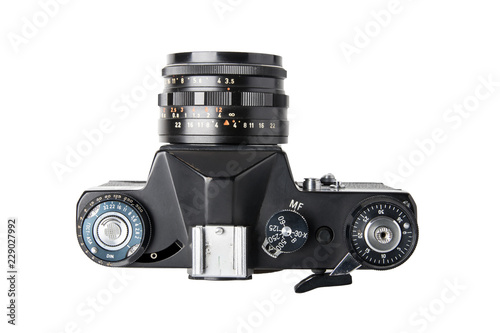 Camera isolated. Top view on a old film mirror SLR camera isolated on a white background. Concept vintage and retro.