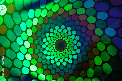 Spinning RGB colored hallucination on a wall