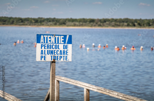 Warning sign at the salt lake Braila Romania photo