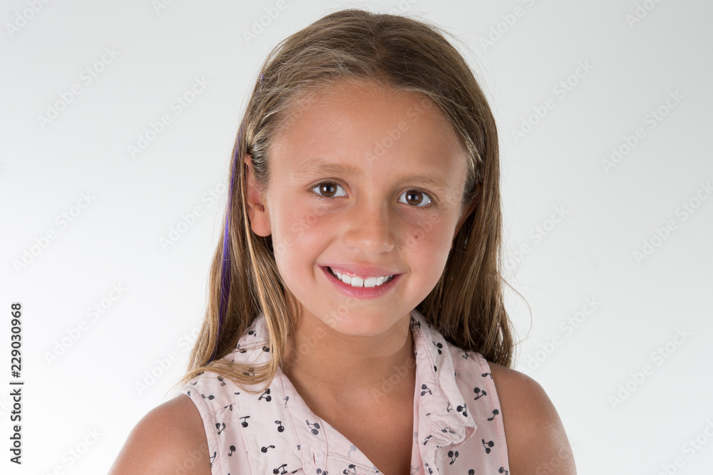 portrait of young girl on grey wall background portrait of young girl on grey wall background