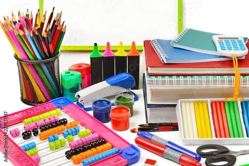 Assortment of school and office supplies isolated on white background.