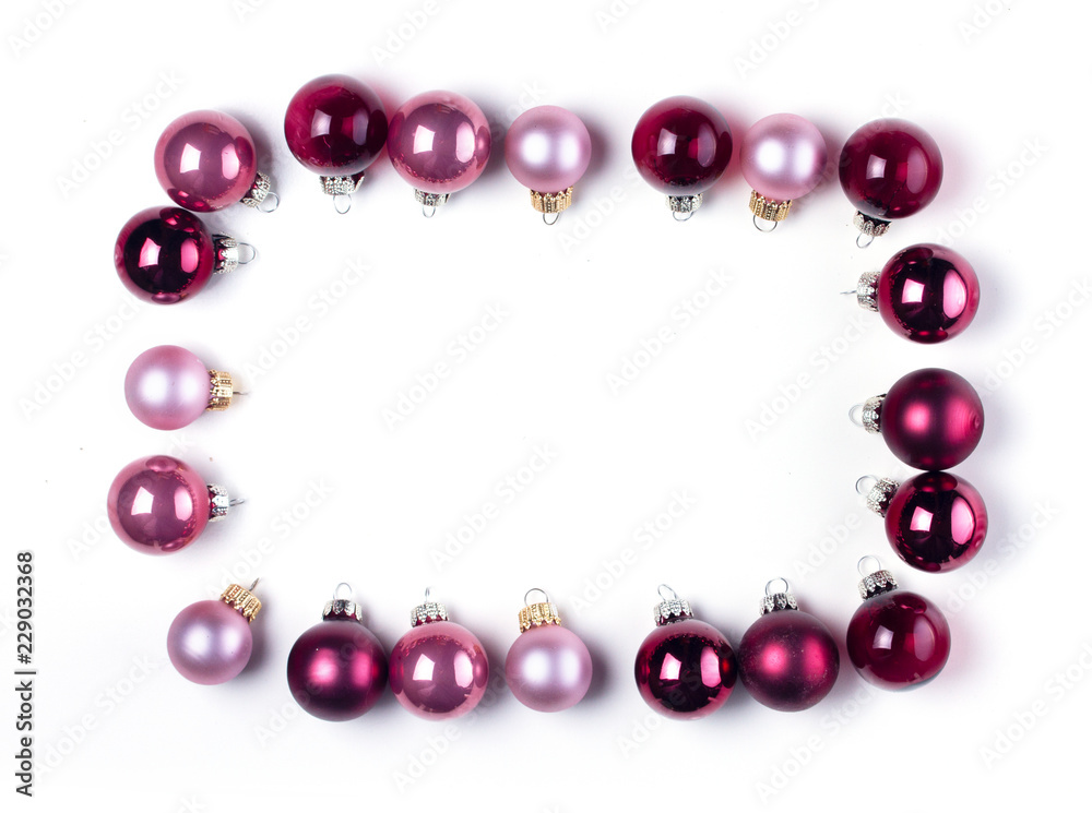 Christmas flat lay frame of pink abd violet glass ball decorations Christmas flat lay frame of pink abd violet glass ball decorations