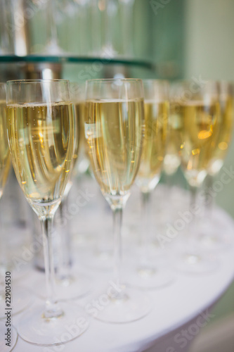 glasses with sparkling wine at corporate party