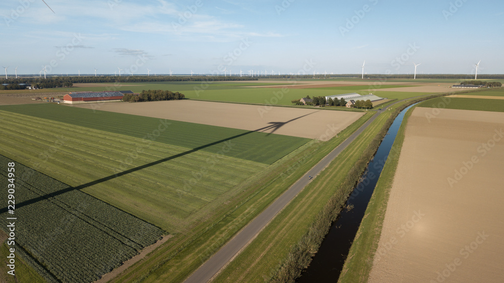 Wind turbine shadow in polder landscape