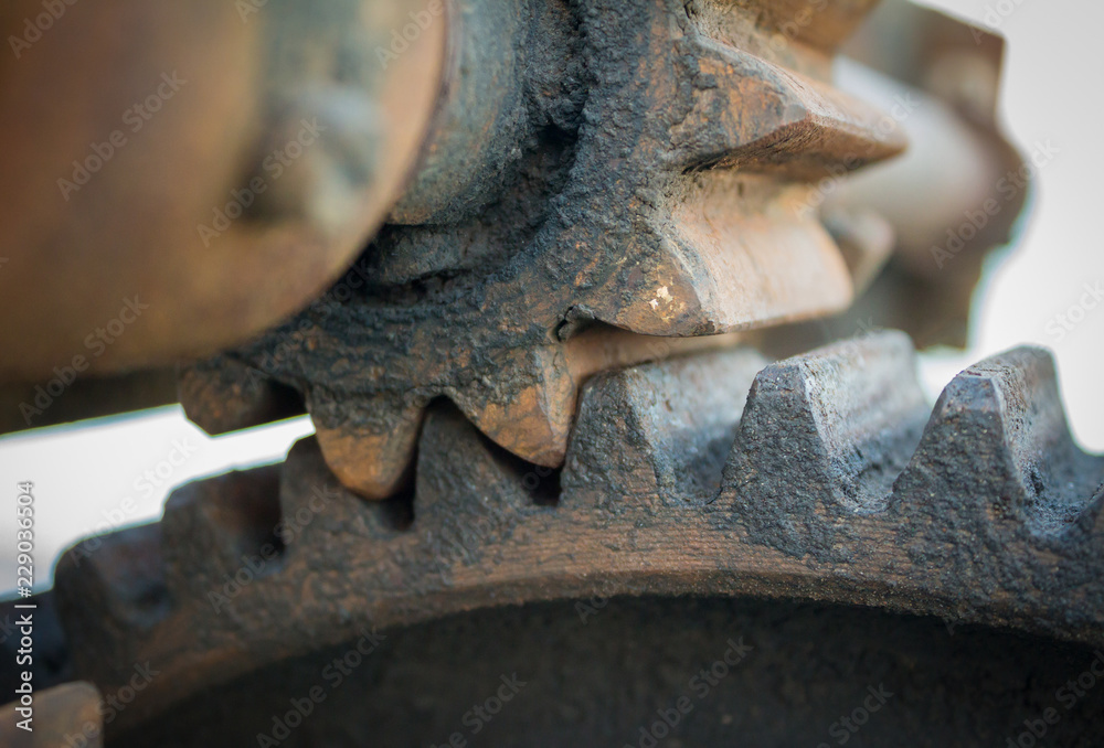 Very close view of machine gear parts - rusty but working Very close view of machine gear parts - rusty but working