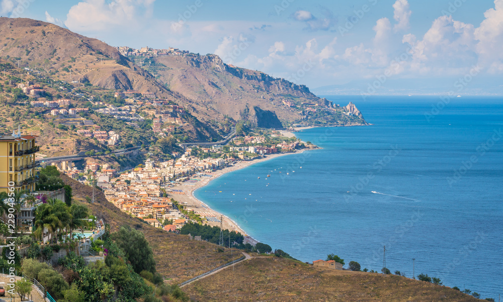 Panoramic sight of the sicilian coastline as seen from Taormina. Province of Messina, Sicily, southern Italy.