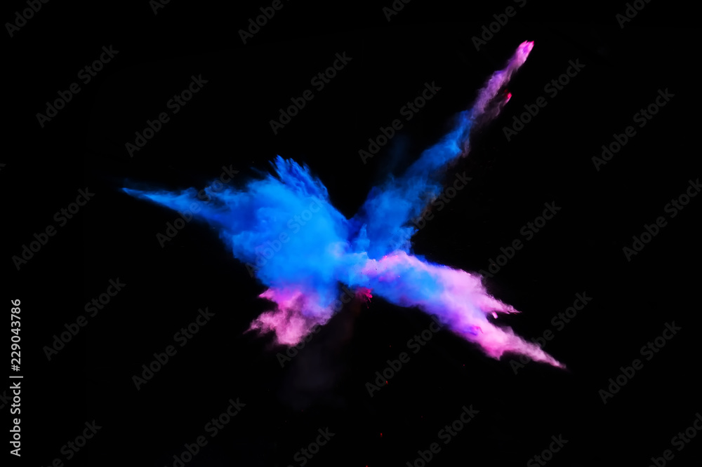 Fantastic forms of powder paint and flour combined  together explode in front of a black background to give off fantastic  explosions in bizarre multi colored cloud forms.