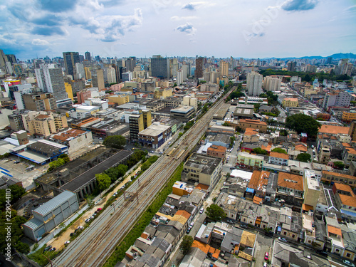  Great cities, great avenues, houses and buildings. Light district (Bairro da Luz), Sao Paulo Brazil, South America. Rail and subway trains. Aerial view of State Avenue next to the Tamanduatei River 