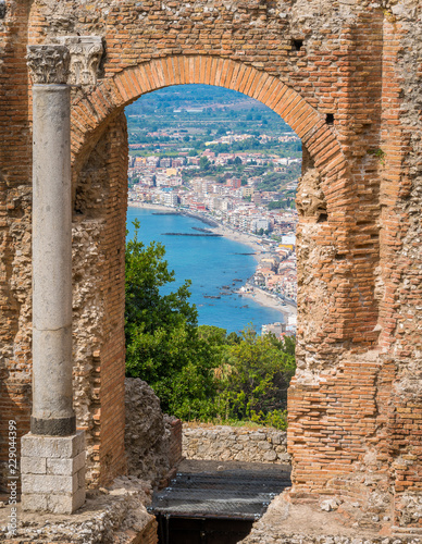 Ruins of the Ancient Greek Theater in Taormina with the sea in the background. Province of Messina, Sicily, southern Italy. photo