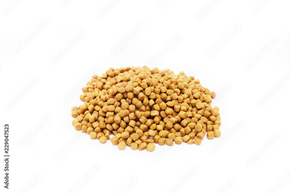Dried pet food in the shape of balls on white background. Isolated on white Dried pet food in the shape of balls on white background. Isolated on white