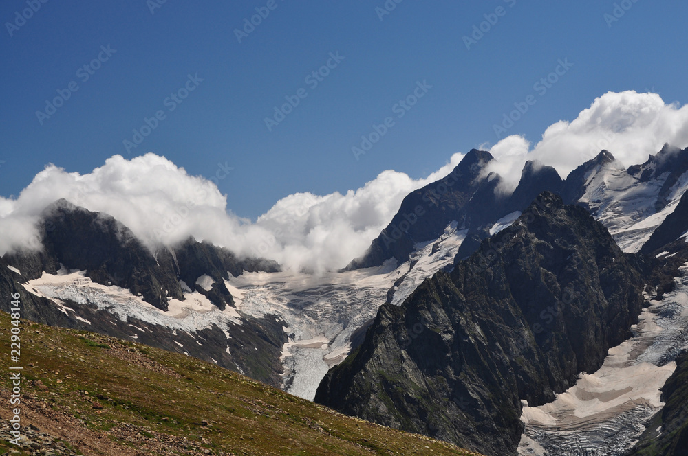 Closeup mountains scenes in national park Dombai, Caucasus, Russia, Europe. Sunshine weather and blue sky, summer day Closeup mountains scenes in national park Dombai, Caucasus, Russia, Europe. Sunshine weather and blue sky, summer day