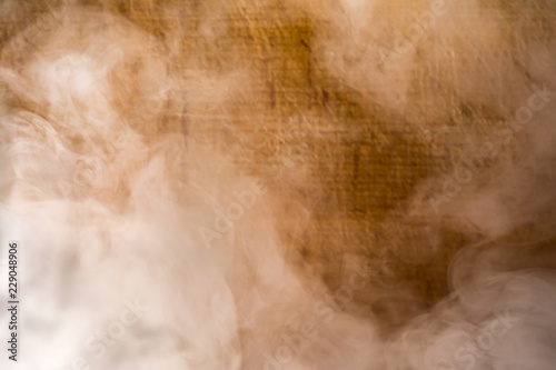 gray smoke on brown plank background, blur abstract background