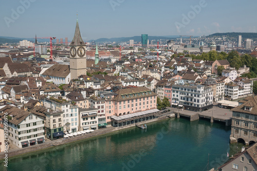 Zurich, Switzerland - June 19, 2017: Aerial view of historic Zurich city center and river Limmat from Grossmunster Church, Switzerland. Summer landscape © TravelFlow