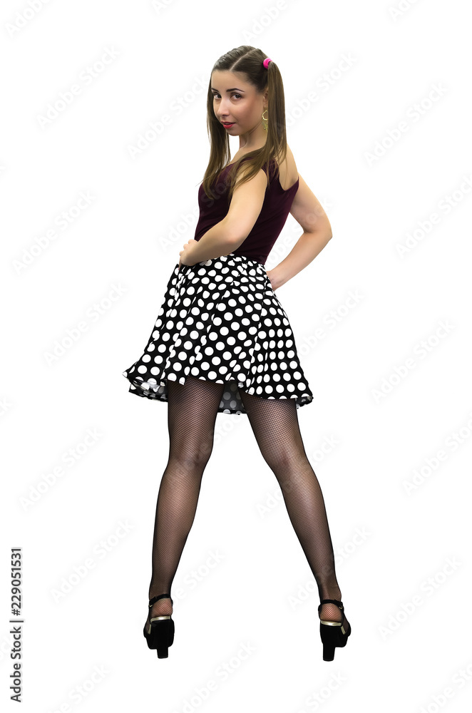 Young Pin Up Girl In Polka dot Dress Black Stockings And In High Heels Young Pin Up Girl In Polka dot Dress Black Stockings And In High Heels