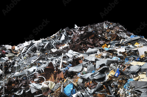 Pile of metal trash on a black background photo