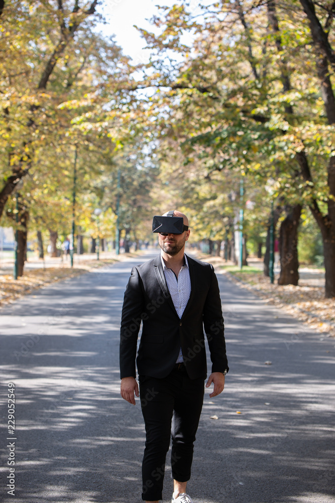 Businessman have fun with Virtual Reality VR Headset BOX Businessman have fun with Virtual Reality VR Headset BOX